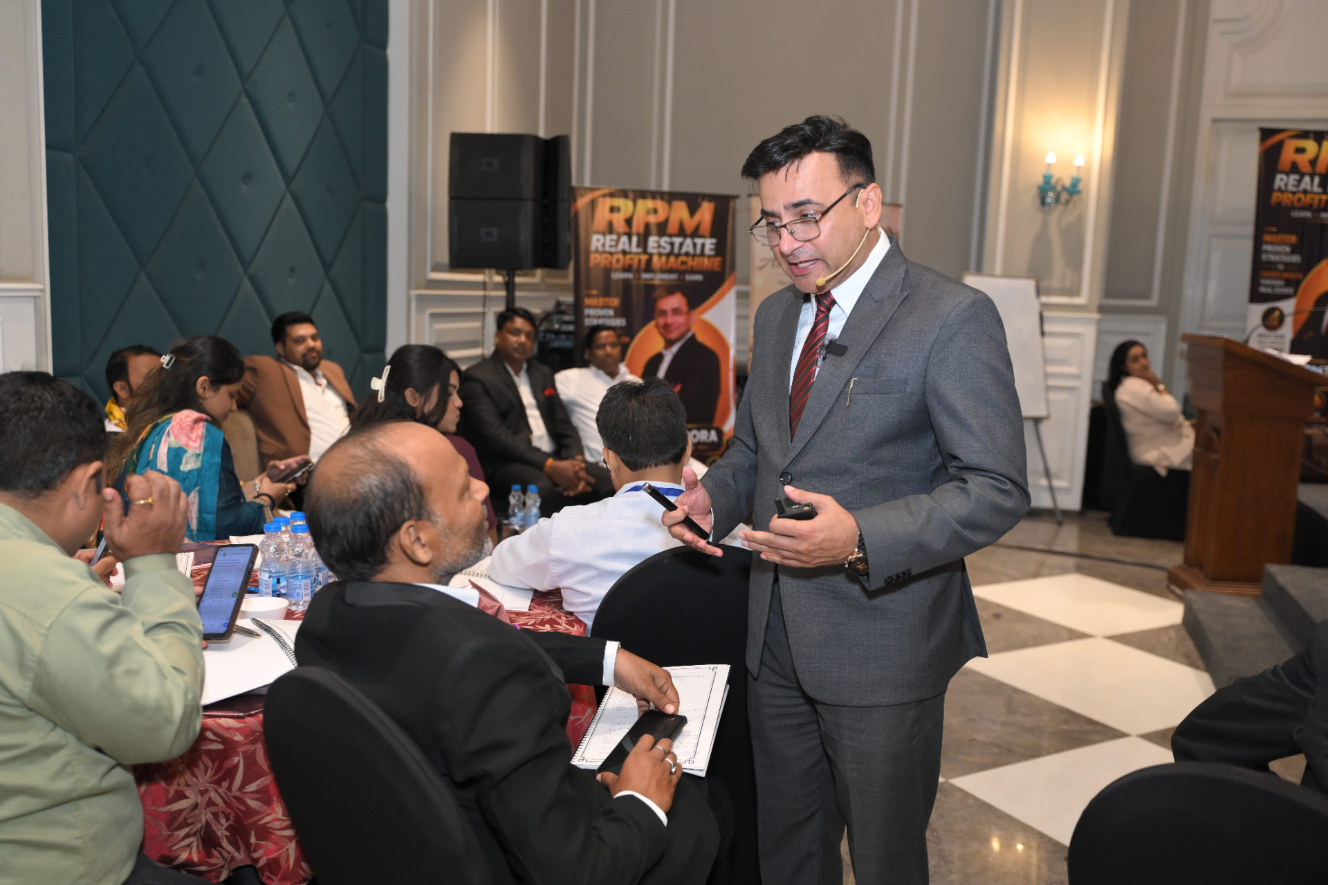 Dr. Lalit Arora coaching attendees at their table during the workshop