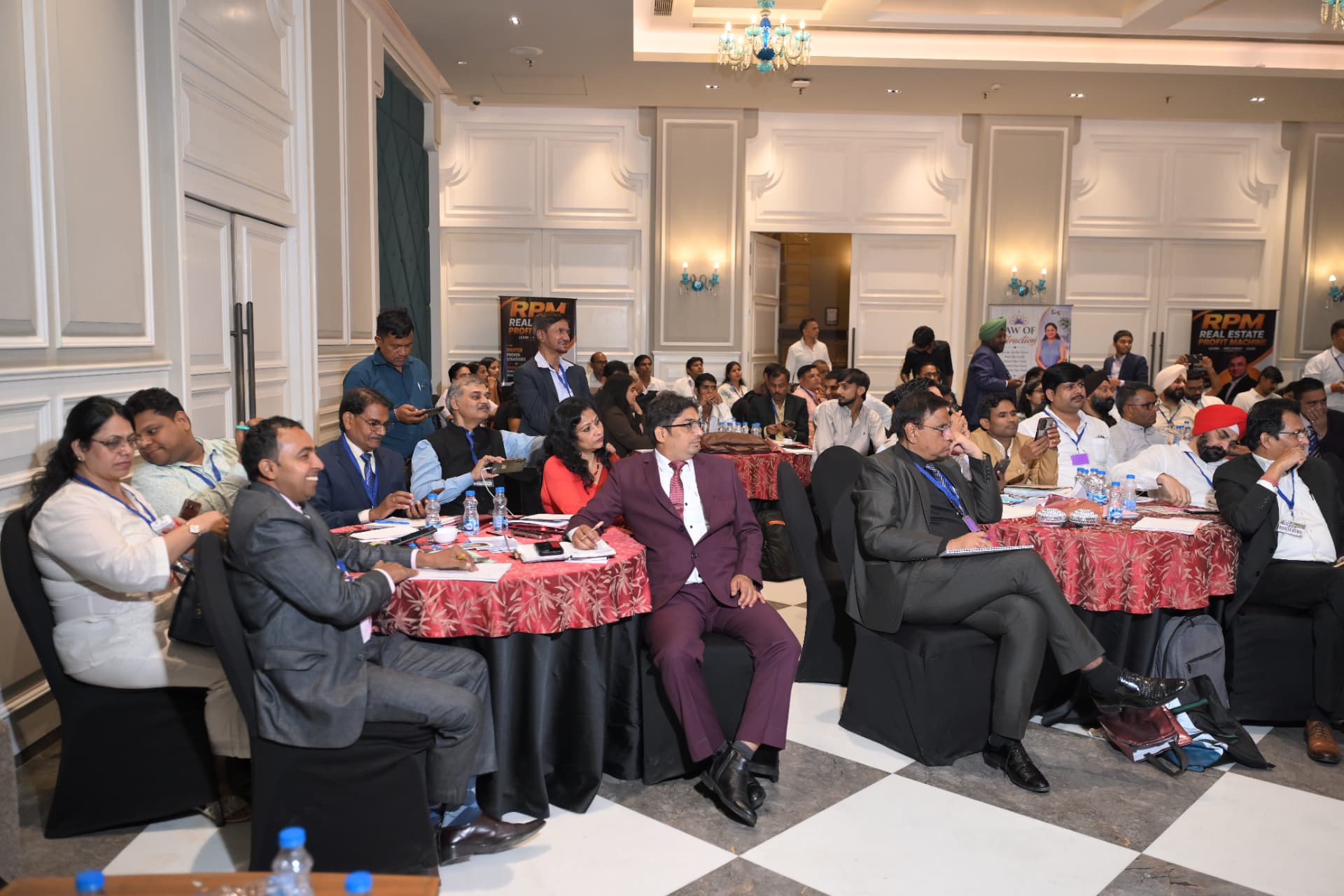 Brokers seated across the hall during a working session